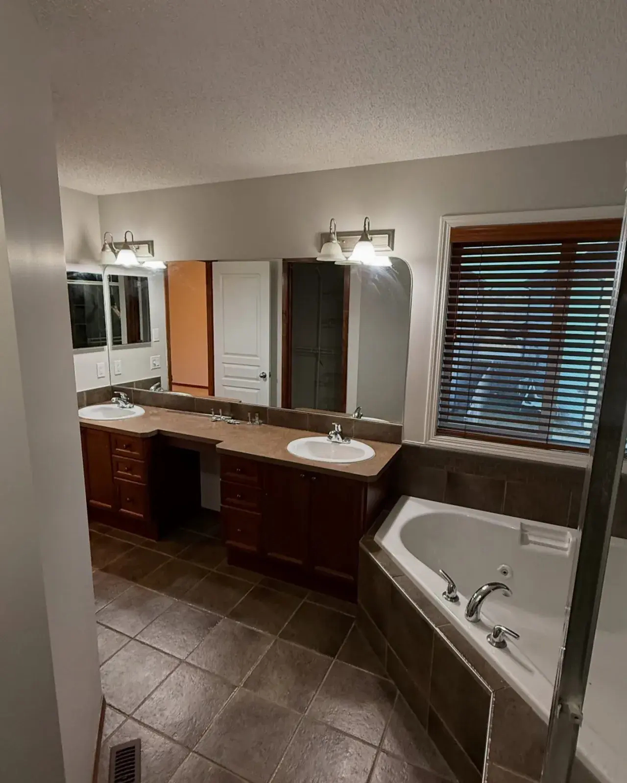 Master Bath Repaint — A clean, refreshed master bath with a corner soaker tub