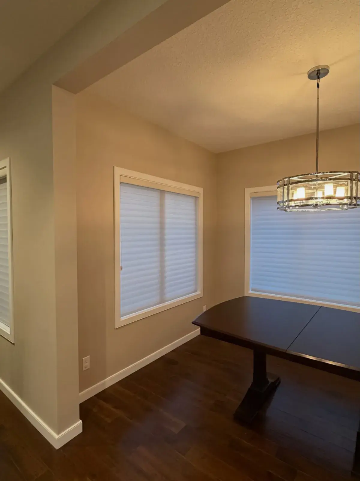 Dining Nook Repaint — A cozy dining nook with warm walls and crisp trim