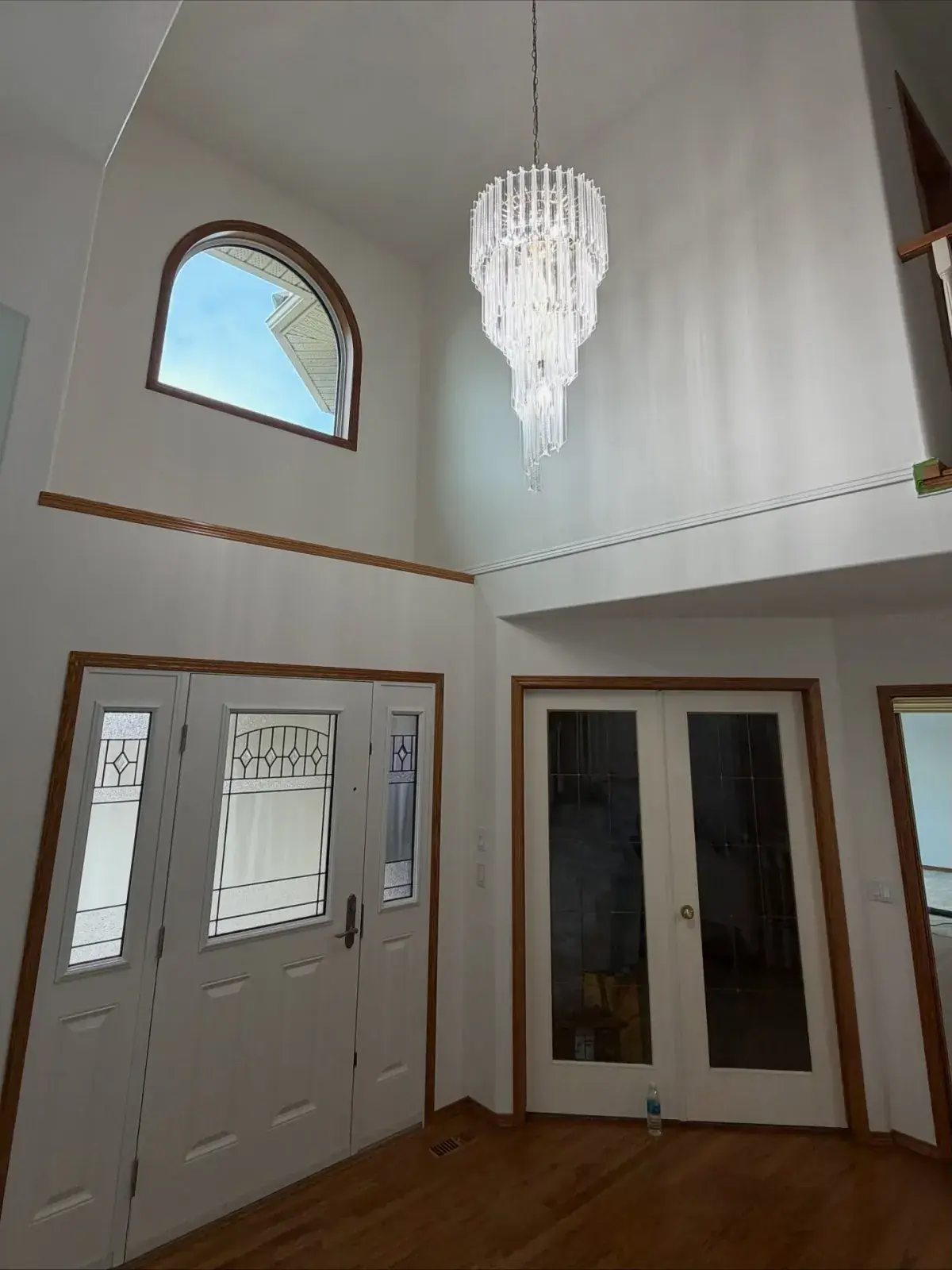 Grand Entry Foyer — A soaring two-storey foyer painted crisp and bright
