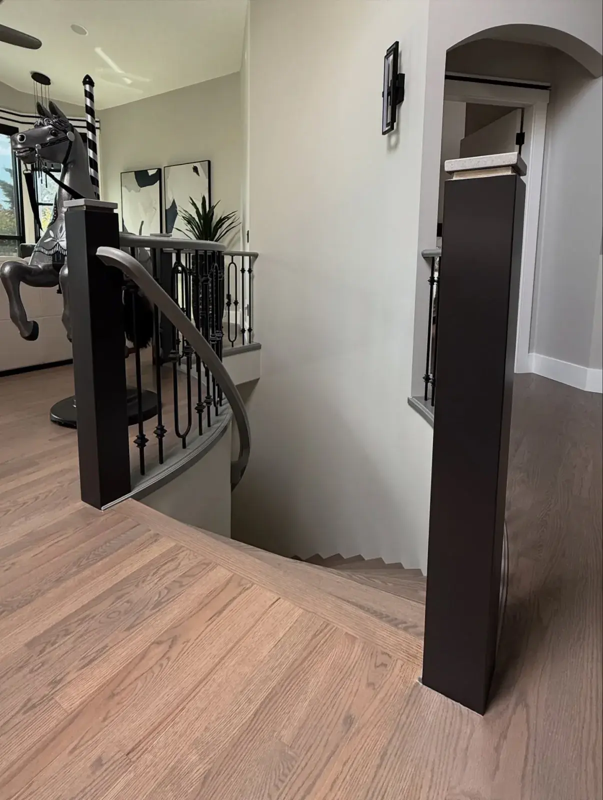 Upper Landing & Railing — Crisp walls and refreshed railings on a modern landing
