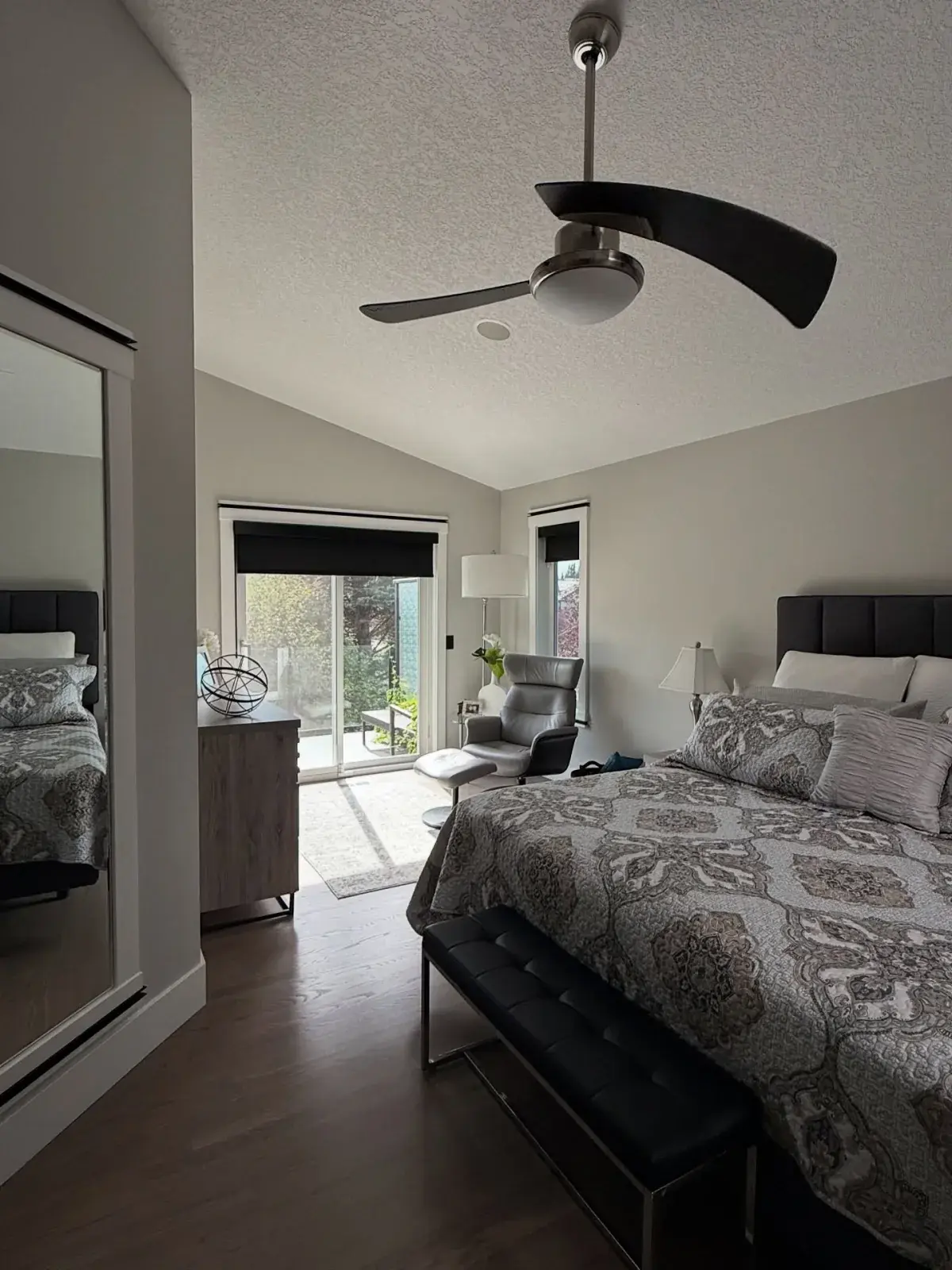 A modern Calgary master bedroom freshly painted by Chamos Painting — clean lines and a flawless finish