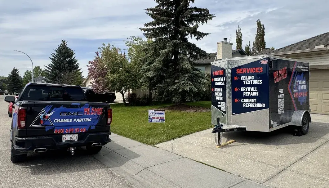 The branded Chamos Painting truck and services trailer ready for a residential painting project in Calgary