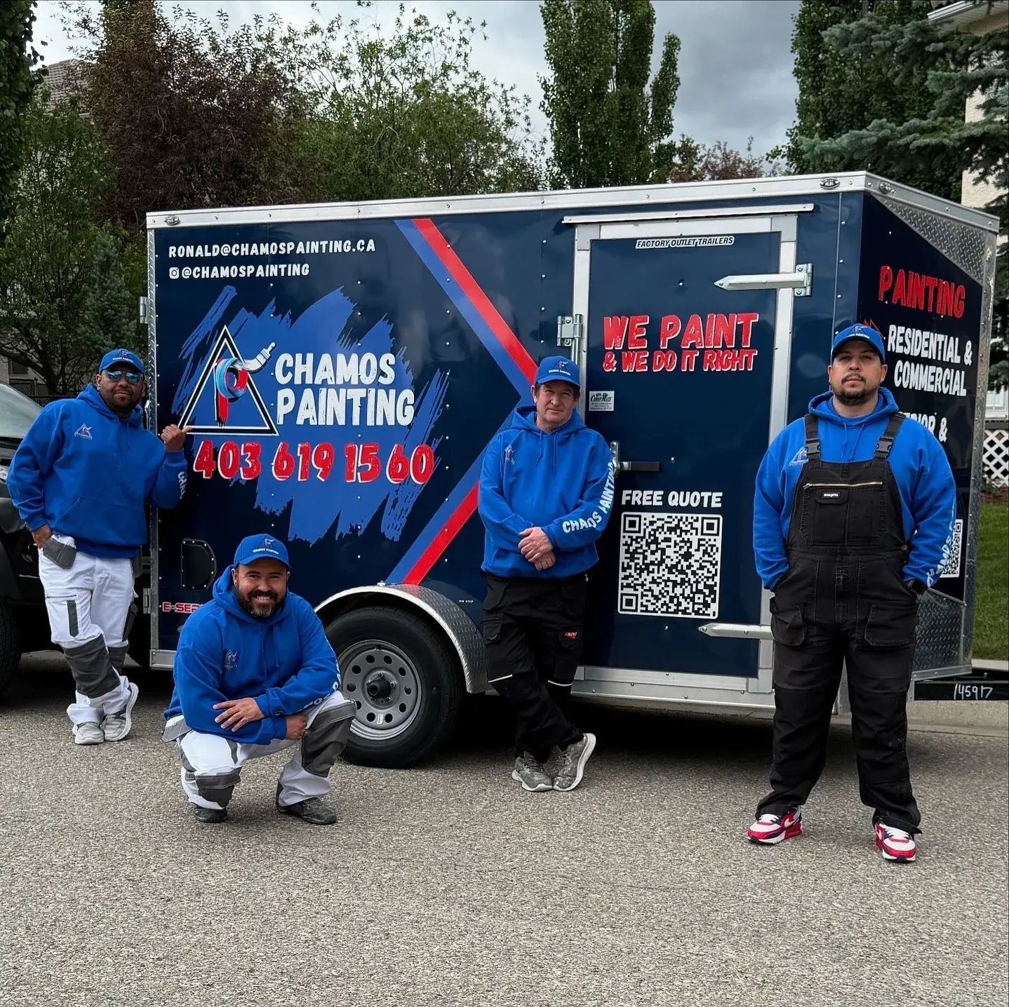 The Chamos Painting crew in front of their branded equipment trailer in Calgary